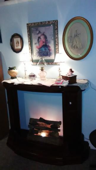 Fireplace Mantel with lit log unit for sale in Norwalk OH